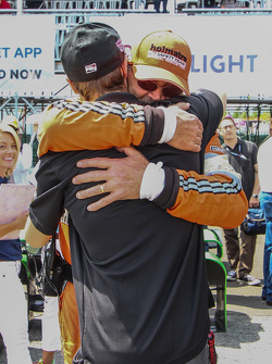 James Hinchcliffe is embraced by a member of the Holmatro Safety Team