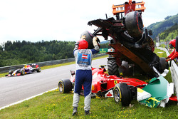 Marshals remove the start crash involving Fernando Alonso, McLaren MP4-30 and Kimi Raikkonen, Ferrari SF15-T