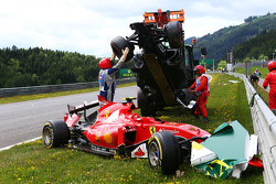Marshals remove the start crash involving Fernando Alonso, McLaren MP4-30 and Kimi Raikkonen, Ferrari SF15-T