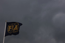 Dark clouds and the FIA flag.