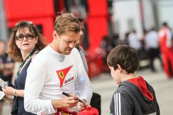 Sebastian Vettel, Ferrari signs autographs for the fans