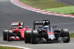 Fernando Alonso, McLaren MP4-30 leads Kimi Raikkonen, Ferrari SF15-T