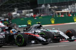 Fernando Alonso, McLaren MP4-30 and Nico Rosberg, Mercedes AMG F1 W06.