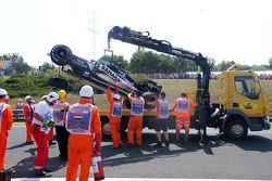 Safety crews tend to the crashed car of Sergio Perez, Sahara Force India F1