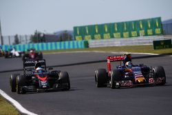 Fernando Alonso, McLaren MP4-30 and Carlos Sainz Jr., Scuderia Toro Rosso STR10