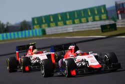 Will Stevens, Manor F1 Team leads Roberto Merhi, Manor F1 Team