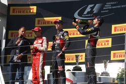 (L to R): Kai Ebel, RTL TV Presenter; Sebastian Vettel, Ferrari; Daniil Kvyat, Red Bull Racing; and Daniel Ricciardo, Red Bull Racing on the podium