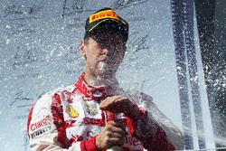 Race winner Sebastian Vettel, Ferrari celebrates on the podium