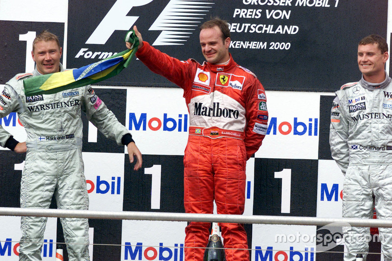 Podium: second place Mika Hakkinen, McLaren and winner Rubens Barrichello, Ferrari and third place David Coulthard, McLaren