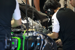 McLaren mechanics work on the McLaren MP4-30 of Fernando Alonso,
