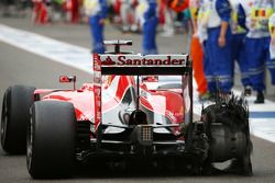 Sebastian Vettel, Ferrari with his punctured Pirelli tyre