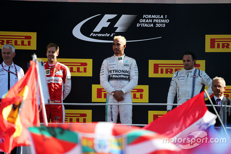 The podium: Sebastian Vettel, Ferrari, second; Lewis Hamilton, Mercedes AMG F1, race winner; Felipe 