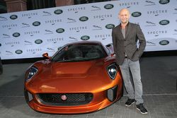 Juergen Vogel next to a Jaguar C-X75 during the presentation of the Jaguar Land Rover vehicles starring in the new Bond film Spectre