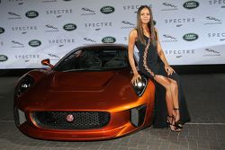 Naomi Harris ( James Bond Spectre, Miss Moneypenny )next to a Jaguar C-X75 during the presentation of the Jaguar Land Rover vehicles starring in the new Bond film Spectre
