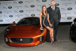 Naomi Harris ( James Bond Spectre, Miss Moneypenny ) and Dave Bautista ( James Bond Spectre, Mr. Hinx ) next to a Jaguar C-X75 during the presentation of the Jaguar Land Rover vehicles starring in the new Bond film Spectre