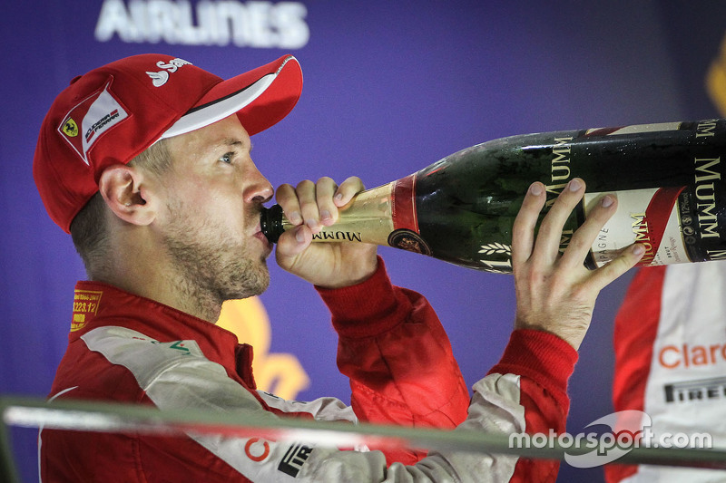 Race winner Sebastian Vettel, Ferrari celebrates on the podium