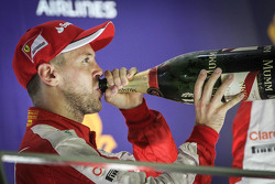 Race winner Sebastian Vettel, Ferrari celebrates on the podium