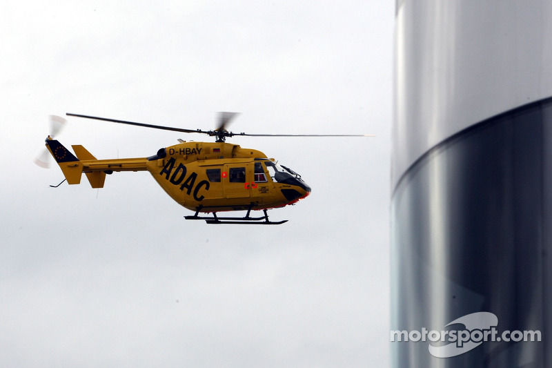 Helicopter with Lewis Hamilton, McLaren Mercedes, in is passing the MCL Motorhome