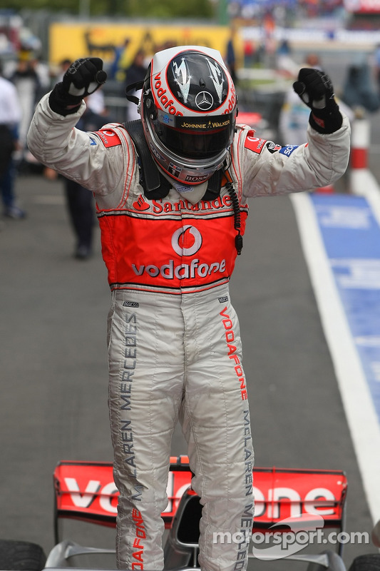 Race winner Fernando Alonso celebrates