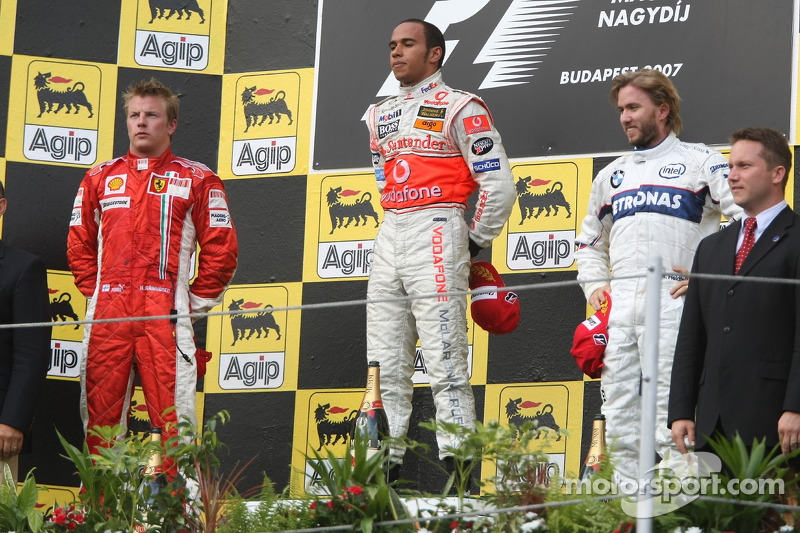 Podium: race winner Lewis Hamilton with second place Kimi Raikkonen and third place Nick Heidfeld