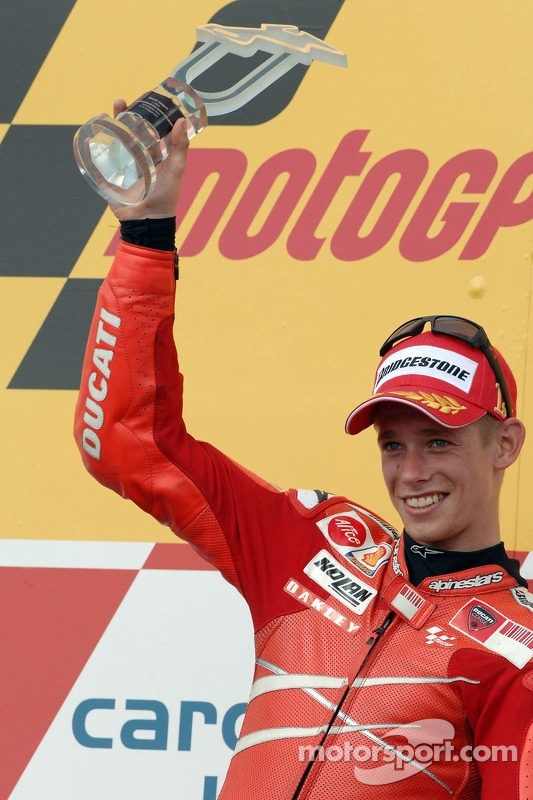 Podium: race winner Casey Stoner celebrates