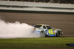 Race winner Jimmie Johnson does a burnout