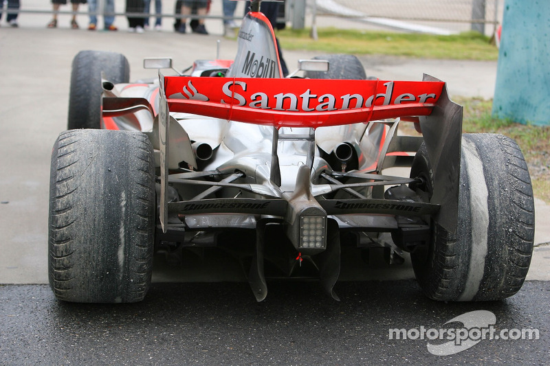 Lewis Hamilton's, McLaren Mercedes parked at the side of the track with badly worn tyres