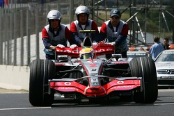 Lewis Hamilton, McLaren Mercedes, MP4-22 is pushed back to Parc Ferme