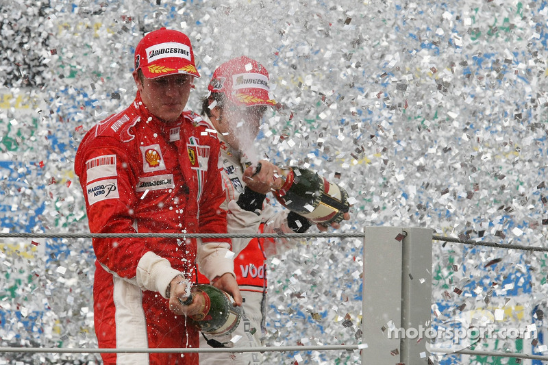 Podium: champagne for Kimi Raikkonen and Fernando Alonso