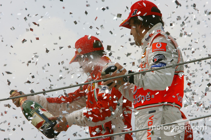 Podium: champagne for Kimi Raikkonen and Fernando Alonso