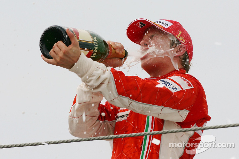 Podium: champagne for Kimi Raikkonen