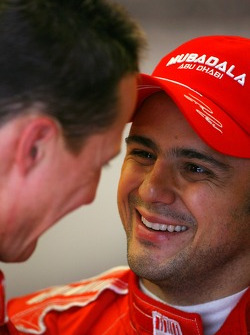 Felipe Massa, Scuderia Ferrari and Michael Schumacher, Test Driver, Scuderia Ferrari, share a joke
