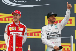 (L to R): second placed Sebastian Vettel, Ferrari with race winner Lewis Hamilton, Mercedes AMG F1 on the podium