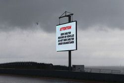 Heavy rainfall delays the start of FP2 as warning signs are displayed around the circuit