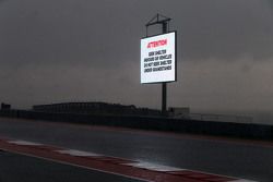 Heavy rainfall delays the start of FP2 as warning signs are displayed around the circuit