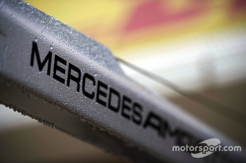 Rain drops on a Mercedes AMG F1 logo