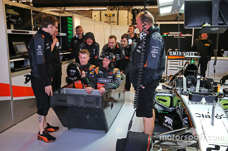 The Sahara Force India F1 Team have some fun during a wet qualifying session