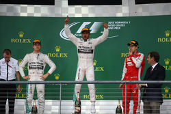 The podium: Second place Nico Rosberg, Mercedes AMG F1, Race winner and World Champion Lewis Hamilton, Mercedes AMG F1, and third place Sebastian Vettel, Ferrari