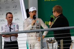Podium: Paddy Lowe, Mercedes AMG F1 Executive Director, with second place Nico Rosberg, Mercedes AMG F1 and Sir Elton John