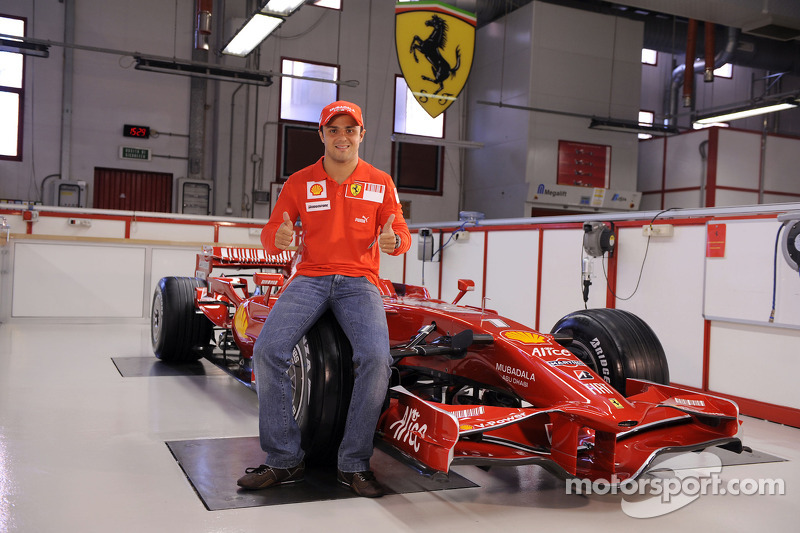 Felipe Massa poses with the new Ferrari F2008