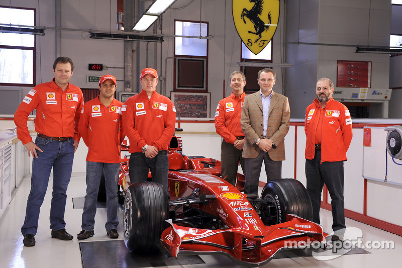 Kimi Raikkonen, Felipe Massa, Stefano Domenicali and team members pose with the new Ferrari F2008