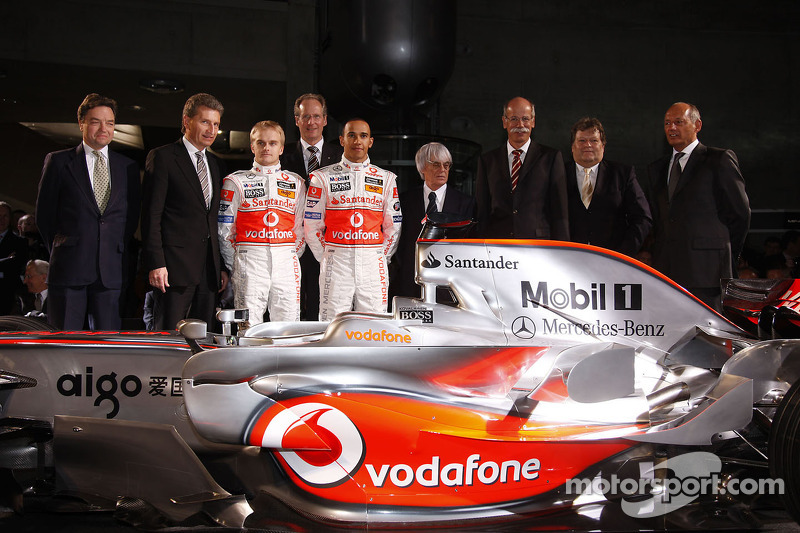 Lewis Hamilton, Heikki Kovalainen, Ron Dennis, Norbert Haug, Bernie Ecclestone and McLaren Mercedes team members pose with the new McLaren Mercedes MP4-23