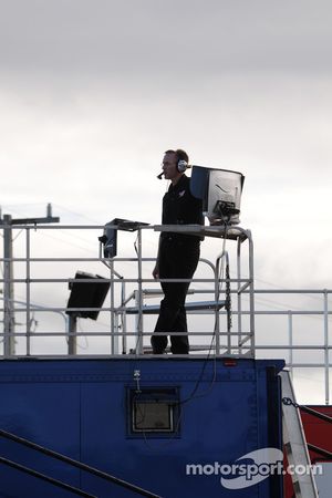 Haas team members watches testing action atop the transporter