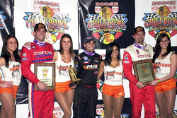 Tulsa Expo Raceway's 22nd Annual Dodge Chili Bowl Nationals winner Damion Gardner (center) is joined by runner-up Dave Darland (right) and third-place finisher Shane Cottle (left)
