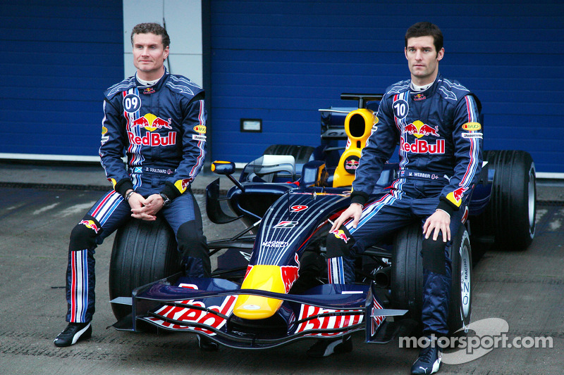 David Coulthard and Mark Webber pose with the new Red Bull RB4