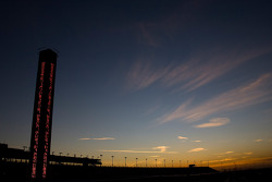 The sun sets on the grandstand at the Auto Club Speedway of Southern California