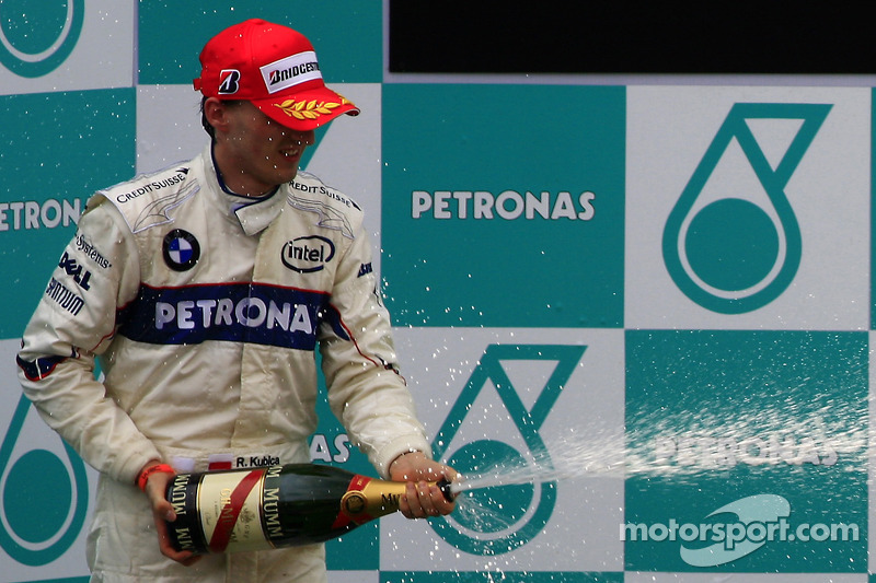 Podium: race winner Kimi Raikkonen, second place Robert Kubica