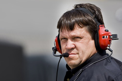 Robbie Reiser watches his cars on the track