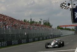 Robert Kubica takes the checkered flag