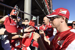 Sebastian Vettel, Ferrari signs autographs for the fans